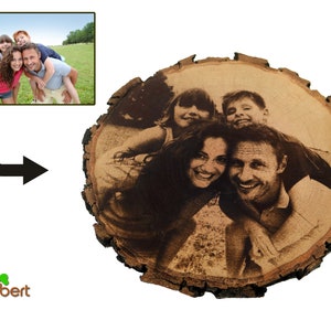 May include: A family portrait engraved on a round wooden slice. The image shows a family of four, a man, a woman, and two children, smiling and looking at the camera.