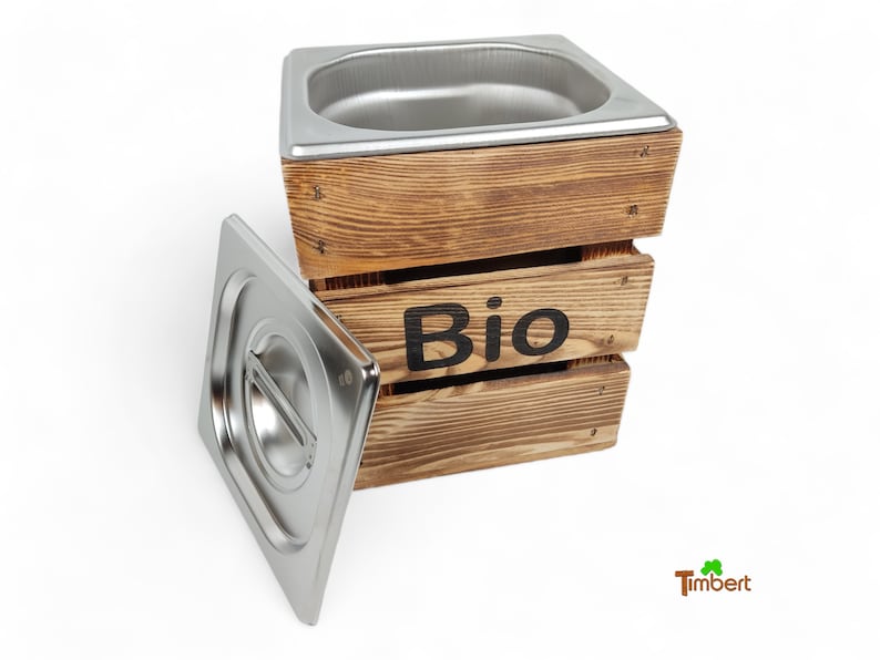 May include: A wooden compost bin with a stainless steel liner and lid. The bin is labelled "Bio".