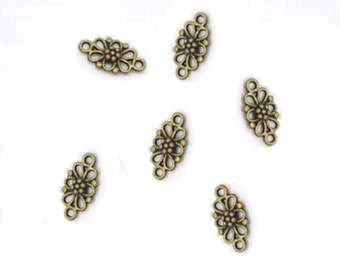 6 bronze-colored metal flower connectors