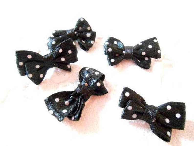 Five bows in black fabric with white dots. image 2
