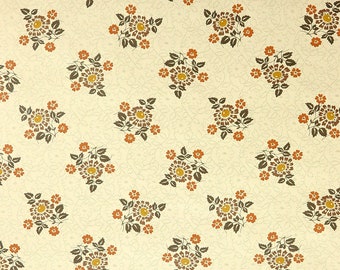 May include: A seamless pattern of brown and orange floral bouquets on a cream background. The flowers are stylized and have a retro feel.