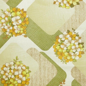 May include: Vintage wallpaper featuring a geometric design of green and brown squares and rounded rectangles. The pattern is highlighted with clusters of yellow, white, and orange flowers.
