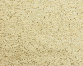 May include: A close-up of a textured, light beige cork surface. The cork has a natural, organic appearance with variations in color and texture, creating a warm, neutral backdrop. The surface is ideal for home decor.