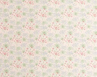 May include: A seamless pattern of small pink and blue flowers on a white background. The flowers are arranged in a repeating pattern, creating a delicate and feminine design.