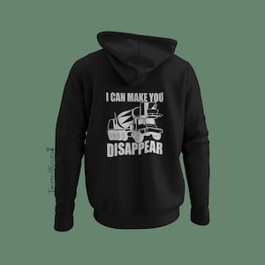 May include: A black hooded sweatshirt featuring a white graphic on the back. The design displays a cement mixer truck illustration centered between the text "I CAN MAKE YOU" above and "DISAPPEAR" below. The hoodie has long sleeves and a hood.