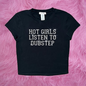 May include: Black cropped t-shirt with the text "HOT GIRLS LISTEN TO DUBSTEP" in rhinestones.