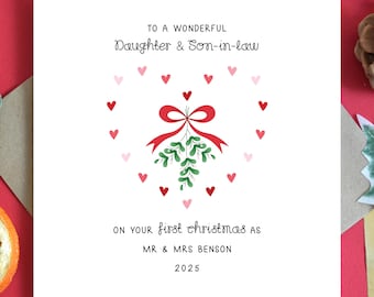 May include: A square white Christmas card featuring a red and green mistletoe design and red and pink hearts. The card reads "TO A WONDERFUL Daughter & Son-in-law" and "ON YOUR first christmas as MR & MRS BENSON 2025."