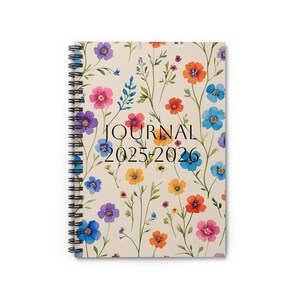 May include: A spiral-bound journal with a floral design. The cover features a cream background with watercolor flowers in shades of pink, orange, blue, and purple. The text "JOURNAL 2025-2026" is printed in black.
