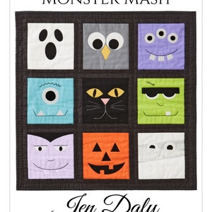 May include: A handmade quilt featuring nine square panels, each depicting a different monster face. The quilt includes a ghost, owl, three-eyed monster, cat, Frankenstein, vampire, jack-o'-lantern, and mummy. The text "MONSTER MASH" and "Jen Daly Quilts" are also visible.