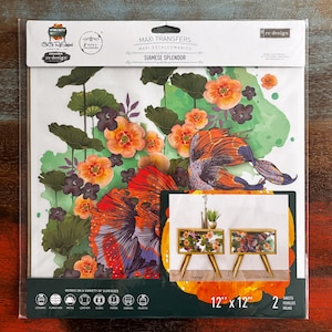 May include: A package of Maxi Transfers decals, featuring a vibrant floral and fish design titled "Siamese Splendor." The design includes orange, purple, and green elements, with a fish illustration. The package is 12" x 12" and includes two sheets.