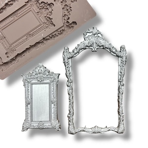 May include: Two silver ornate picture frames with intricate details. The larger frame has a rounded top and the smaller frame has a rectangular top.