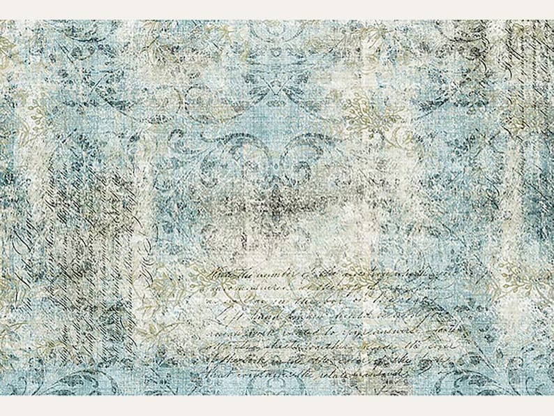 A3 rice decoupage paper of a faded light blue and cream colored fabric that has a worn damask scroll design and script writing. Soft white borders on the top and bottom.