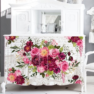 A large white dresser buffet that has the royal burgundy transfer across the front.