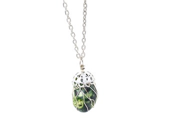 Green dyed bamboo coral wire-wrapped pendant necklace on 24 inch silver tone chain