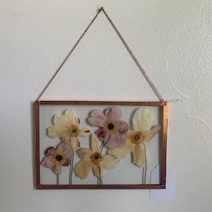 May include: A set of three ceramic mugs with a speckled, matte finish. The mugs are in shades of cream, light gray, and dark gray. Each mug has a simple, minimalist design, perfect for coffee or tea.