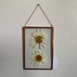 May include: A set of three ceramic mugs with a speckled, matte finish. Each mug features a different color: light blue, cream, and gray. The mugs have a simple, modern design and a comfortable handle.