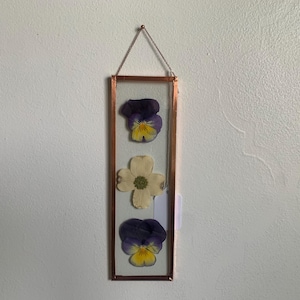 May include: A white ceramic mug with a black handle and the text "But First, Coffee" in a handwritten style. The mug is on a white surface. The mug is approximately 4 inches tall.