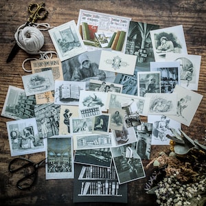May include: A selection of vintage black and white illustrations depicting libraries, books, and readers. The images include text and are arranged on a wooden surface. A ball of twine, scissors, and dried flowers are also visible.
