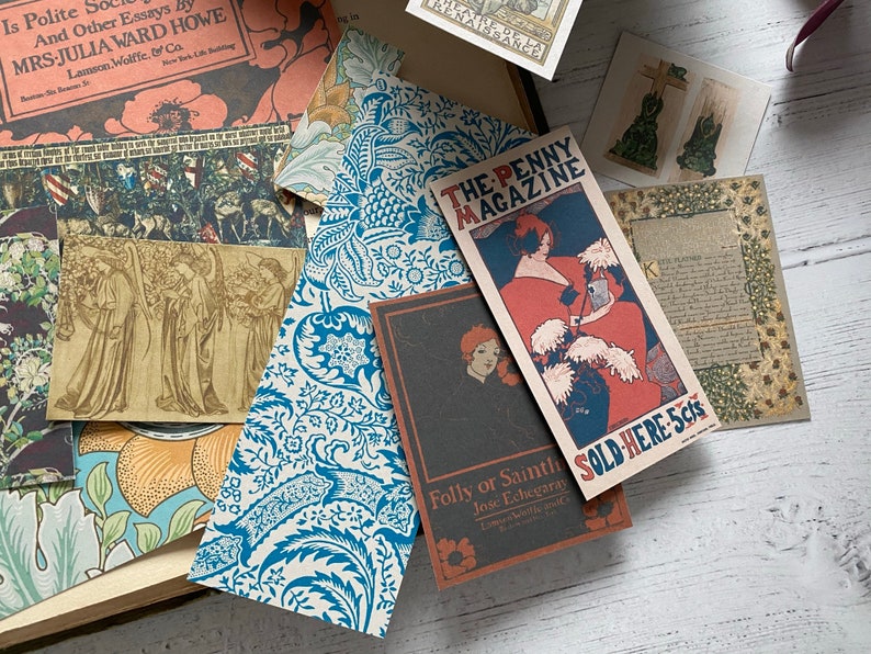 May include: A collection of vintage ephemera, including magazine covers, postcards, and patterned papers. The items feature illustrations, text, and a color palette of blues, reds, and browns. The text includes "The Penny Magazine" and "Sold Here 5cts."