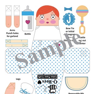 May include: A printable paper craft template for a baby girl doll. The doll is wearing a blue and white polka dot dress, a white bib, and a red bow. The template includes arms, legs, a bottle, a rattle, and a bow tie. The template is labeled "Q-Bees Cubee Paper Crafts".