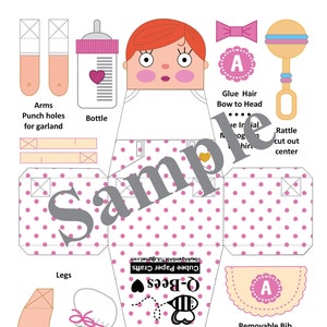 May include: A printable paper craft doll template for a baby girl. The doll is wearing a pink and white polka dot dress and has a removable bib. The template includes instructions for assembling the doll and adding details like hair, a bow, and a rattle.