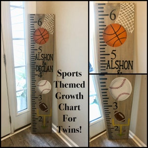 May include: A wooden growth chart with a sports theme. The chart features a basketball, baseball, and football. The chart is marked with numbers from 2 to 6. The names Alshon and Declan are written on the chart.