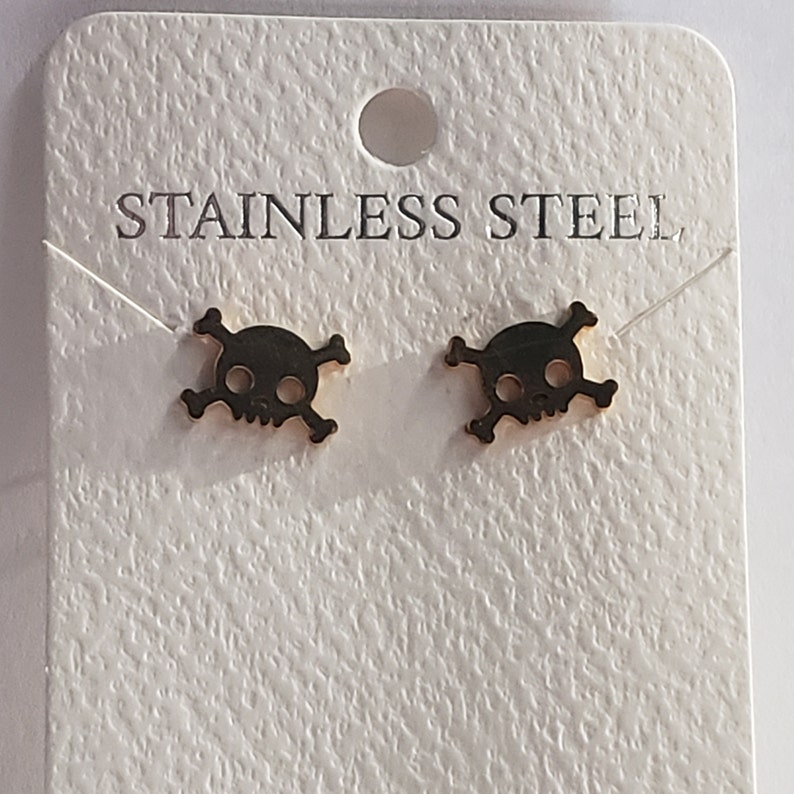 great for Halloween stainless steel Skull and crossbones earring set available in silver and gold