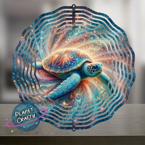 May include: A colorful metal wind spinner with a swirling design featuring a blue sea turtle. The turtle is surrounded by a galaxy-like pattern with stars and swirls of color.
