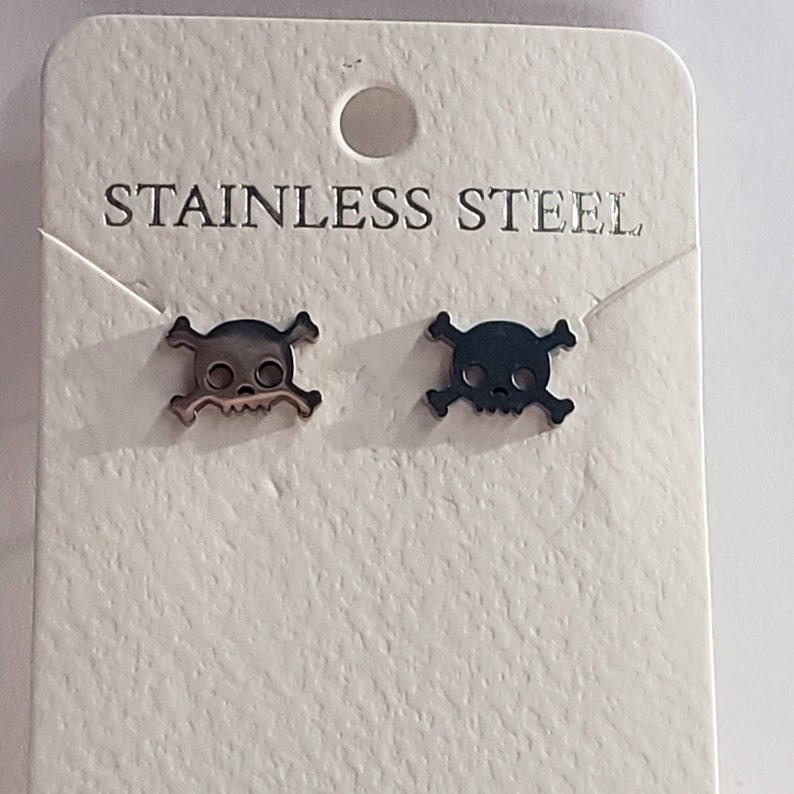 great for Halloween stainless steel Skull and crossbones earring set available in silver and gold
