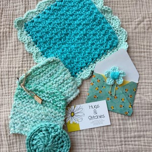 May include: A set of three ceramic vases in varying heights and shapes. The vases are glazed in a matte white finish, offering a minimalist aesthetic. The tallest vase is approximately 10 inches high.