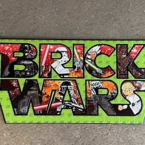 May include: A rectangular sign with a lime green background featuring a repeating circular logo pattern. The large black text reads BRICK WARS, with various Star Wars character figures integrated into the letters against a red and orange background.