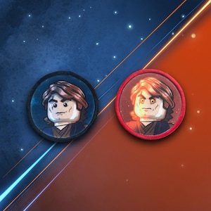 May include: Two round embroidered patches featuring a Lego minifigure of a character with brown hair and a dark blue outfit. The patches are on a red and blue background.