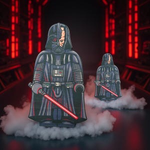 May include: Two stylized Darth Vader figures with red lightsabers, set against a red-lit corridor. The figures are primarily black with gray and red accents, and a portion of the face is exposed. The figures are standing on a cloud-like base.