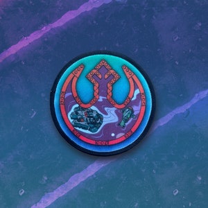 May include: A round, black patch with a blue, red, and white Rebel Alliance symbol. The symbol is surrounded by a red border and a black outline. The patch features a small, green spaceship and a red and black spaceship in the center.