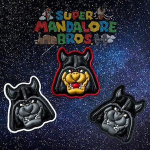 May include: Three embroidered patches featuring a cartoon character in a Darth Vader helmet. The character is a yellow and orange dog with a red nose. The patches are in different colors: red, white, and black.