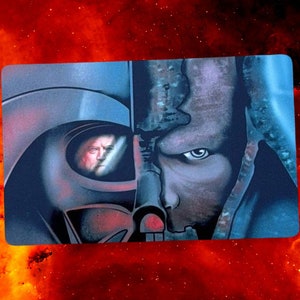May include: A split image of Darth Vader and Anakin Skywalker. The left side shows Darth Vader's helmet and the right side shows Anakin Skywalker's face. The image is a dark blue and gray color.