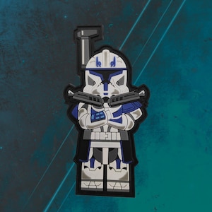 May include: A blue and white cartoon character with a blaster in each hand. The character is wearing a blue and white helmet and armor. The character is standing on a black background.