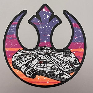 May include: A black and white illustration of the Millennium Falcon spaceship flying through a purple and orange galaxy, inside the Rebel Alliance symbol.