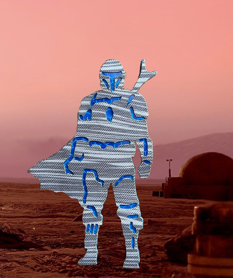 May include: A blue and gray silhouette of a Mandalorian warrior standing in a desert landscape. The warrior is wearing a helmet and armor, and is holding a weapon. The background is a dusty, reddish-brown color.