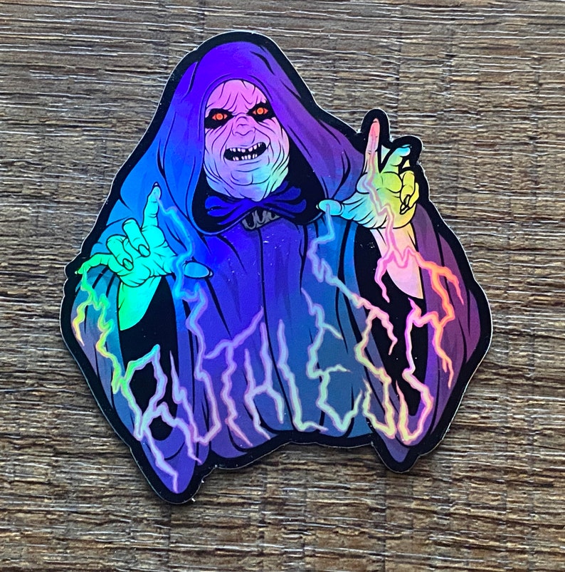 May include: A holographic sticker featuring a purple-robed figure with a menacing expression, surrounded by electric blue lightning bolts. The text "FOREVER" is written in a stylized font.