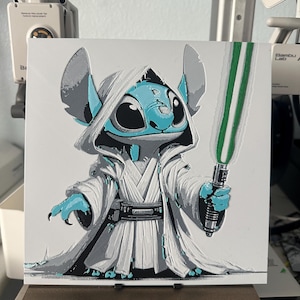 May include: A blue and gray cartoon character with large eyes and a white robe holding a green lightsaber. The character is standing on a white background.
