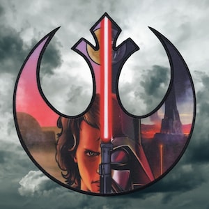 May include: A black and white image of Darth Vader and Luke Skywalker's faces superimposed over the Rebel Alliance symbol. The image is set against a backdrop of a cloudy sky and a distant cityscape.
