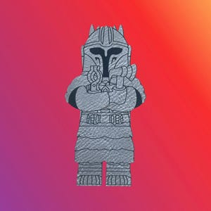 May include: A silver-colored Mandalorian character figurine with a helmet and a weapon. The figurine is standing with its arms crossed.