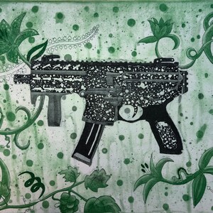 May include: An artistic print featuring a black and white firearm with a speckled pattern, set against a green background with floral and vine elements. The artwork has a unique, illustrative style with a combination of hard and soft elements.