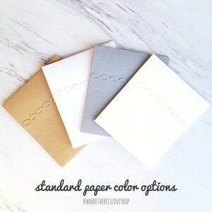 May include: Four different colored cardstock paper samples. The colors are brown, white, gray, and ivory. The paper has a decorative edge.
