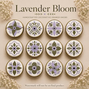 May include: Twelve round drawer knobs with a white base, featuring various floral patterns in shades of lavender and olive green. Each knob has a gold-toned metal rim. The text Lavender Bloom Handcrafted Decorative Drawer Knobs is visible.
