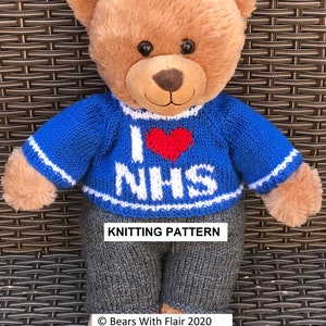 May include: A plush teddy bear wearing a blue knitted sweater with a red heart and the letters "NHS" in white. The bear also wears gray knitted pants. The words "KNITTING PATTERN" are displayed on the image.