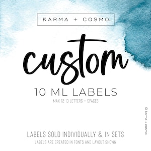 May include: A white background with a blue watercolor wash at the top. The text "KARMA + COSMO." is in a white rectangle at the top. The word "custom" is in large black cursive letters. Below the word "custom" is the text "10 ML LABELS" and "MAX 12-13 LETTERS + SPACES". Below that is the text "LABELS SOLD INDIVIDUALLY & IN SETS" and "LABELS ARE CREATED IN FONTS AND LAYOUT SHOWN".