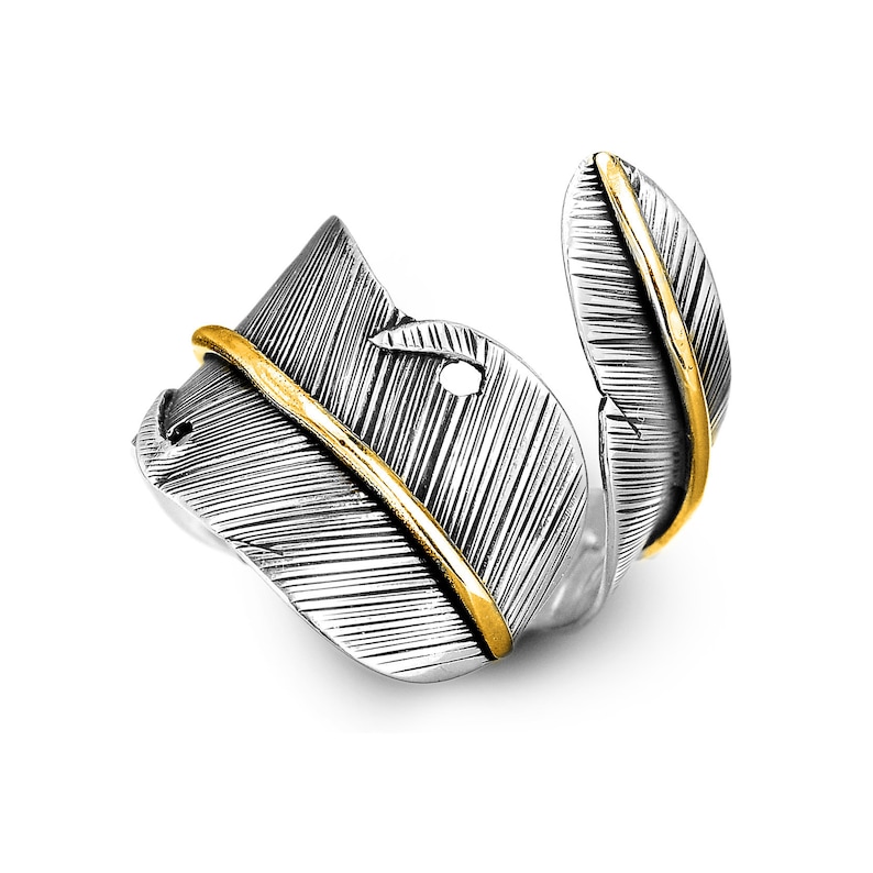 May include: A silver ring with a feather design. The feather is detailed with a gold line down the center.