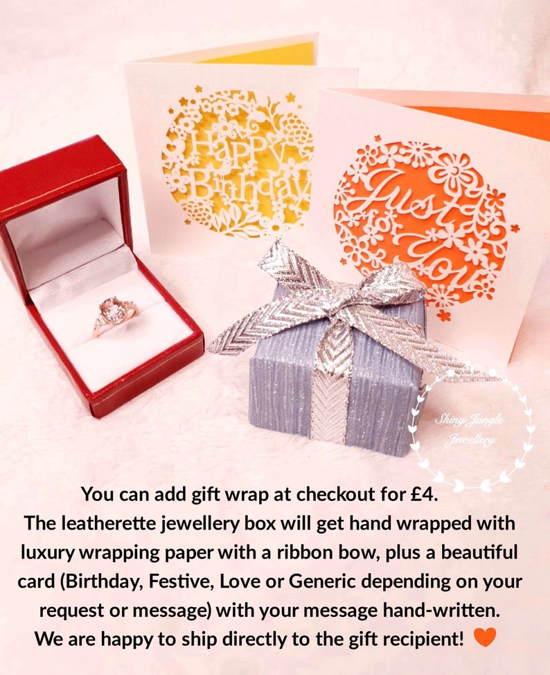 May include: A red jewelry box with a ring, a small gray gift box with a silver bow, and two greeting cards with floral cutouts. One card says "Happy Birthday" and the other says "Just for You".